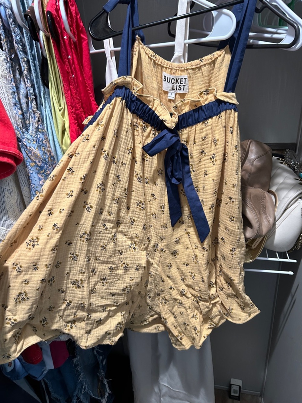 BUCKETLIST Yellow Floral Romper with Navy Bow Trim